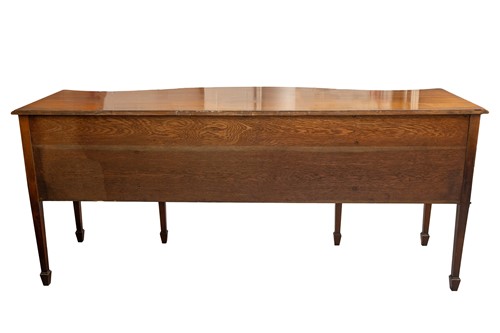 Lot 95 - A mahogany large serpentine sideboard of...