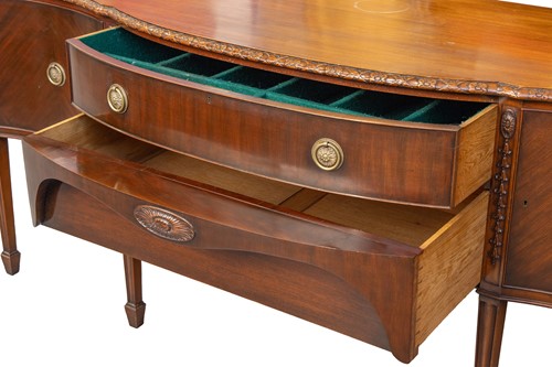 Lot 95 - A mahogany large serpentine sideboard of...