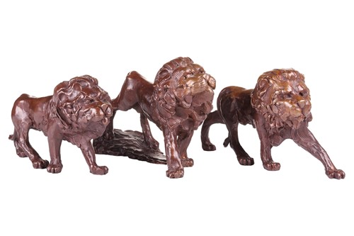 Lot 156 - A group of three cast bronze figues of walking...