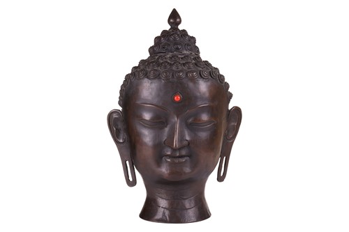 Lot 49 - A patinated bronze head of the Buddha , with...