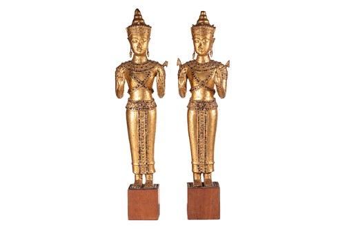 Lot 54 - A pair of Thai cast and gilt bronze figures of...