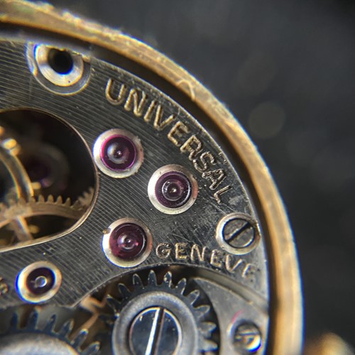 Lot 219 - A sapphire and diamond concealed watch bangle,...