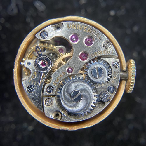 Lot 219 - A sapphire and diamond concealed watch bangle,...