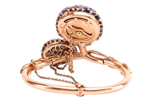 Lot 219 - A sapphire and diamond concealed watch bangle,...