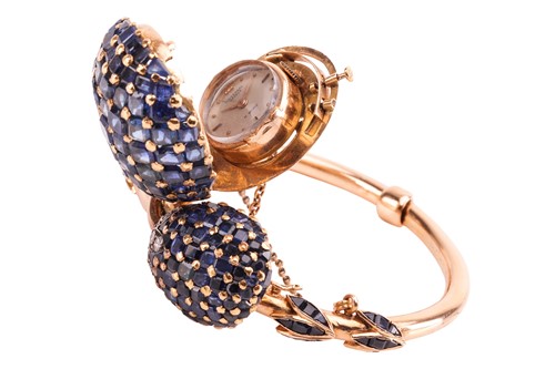 Lot 219 - A sapphire and diamond concealed watch bangle,...