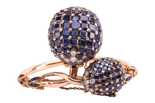 Lot 219 - A sapphire and diamond concealed watch bangle,...