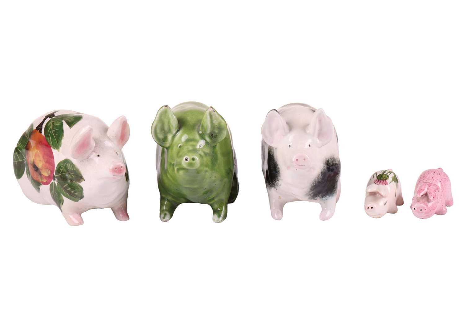 Lot 170 - Three small Wemyss Ware pigs, in black and...