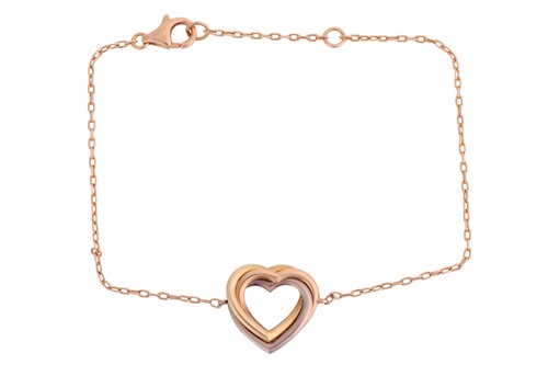 Lot 176 - Cartier - a trinity heart bracelet in...
