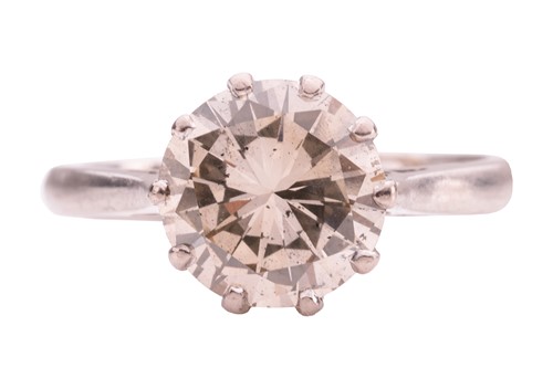 Lot 106 - A solitaire diamond ring, comprising a central...