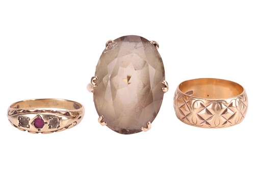 Lot 51 - A group of three rings; The first an oval-cut...