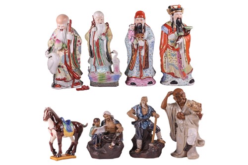 Lot 64 - Eight 20th-century Chinese porcelain figures...