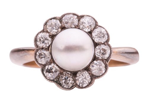 Lot 196 - A pearl and diamond cluster ring; the central...