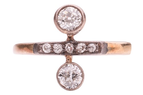 Lot 7 - A diamond two-stone ring resembling a division...