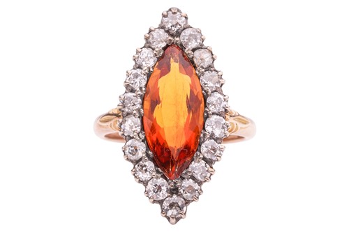 Lot 122 - A navette-cut citrine and diamond cluster ring;...