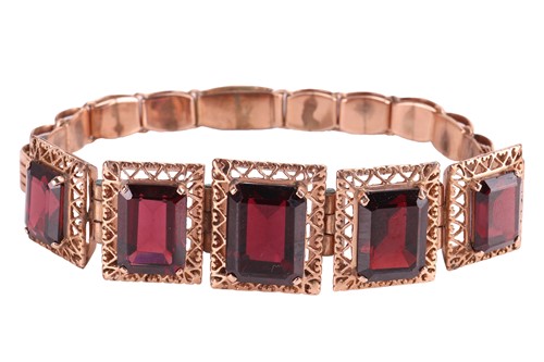 Lot 140 - A garnet-set link bracelet, comprising five...
