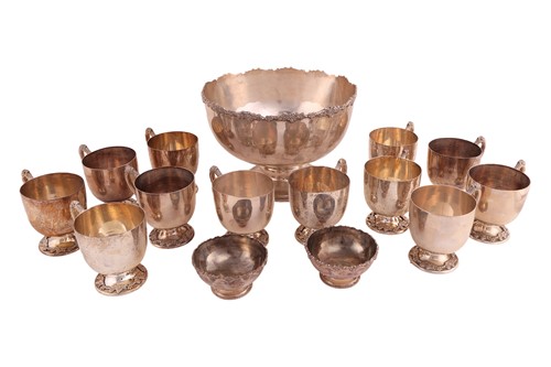 Lot 353 - A white metal punch bowl, twelve cups and two...