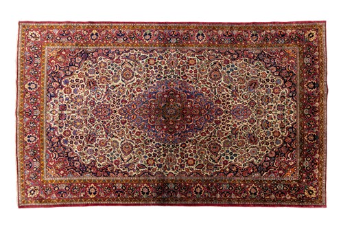 Lot 143 - An old silk on-silk Kashan rug with central...