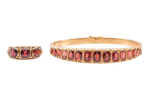 Lot 6 - A garnet-set bangle and ring; comprising a...