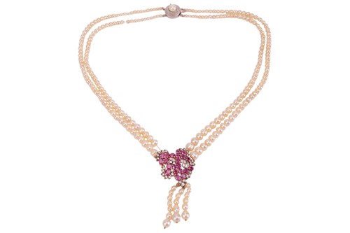 Lot 153 - A cultured pearl necklace centred with a ruby...
