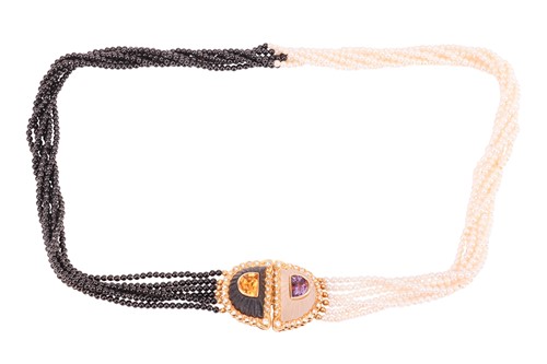 Lot 135 - A pearl and onyx necklace with gem-set set...
