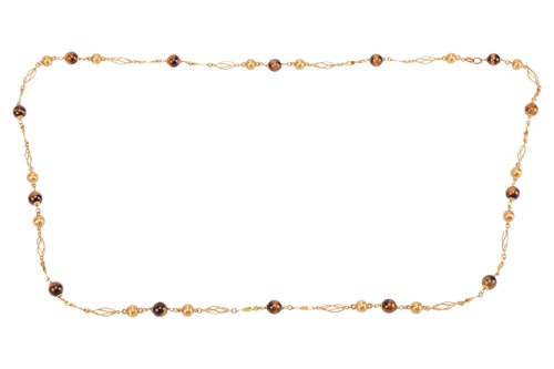 Lot 157 - A fancy link necklace with tiger's eye spacers;...