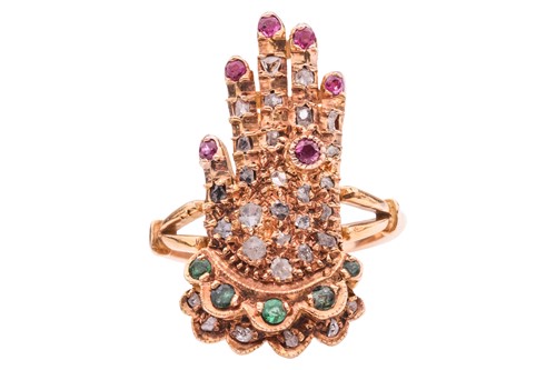 Lot 173 - A gem-set ring in the form of a hand, the...
