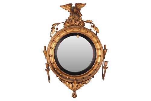 Lot 139 - A Regency giltwood convex girandole mirror,...