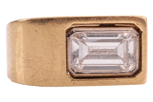 Lot 234 - A Modernist diamond-set ring; the emerald-cut...