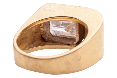 Lot 234 - A Modernist diamond-set ring; the emerald-cut...