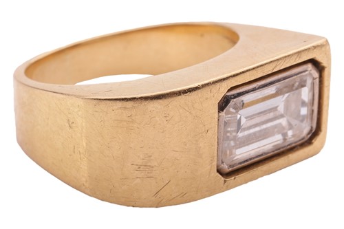 Lot 234 - A Modernist diamond-set ring; the emerald-cut...