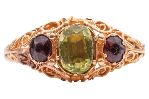 Lot 71 - A peridot and paste ring, featuring a central...