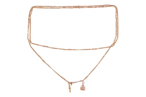 Lot 148 - A pinchbeck guard chain, featuring decorative...