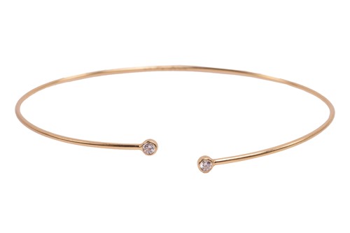 Lot 125 - Tiffany & Co. - a diamond hoop bangle by Elsa...