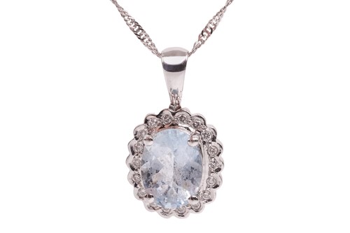 Lot 176 - An aquamarine and diamond halo pendant on...