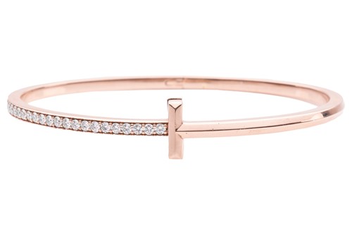 Lot 56 - A diamond-set hinged bangle, in the style of...