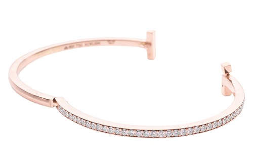 Lot 56 - A diamond-set hinged bangle, in the style of...