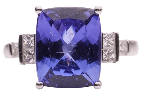 Lot 201 - A tanzanite and diamond dress ring in platinum,...