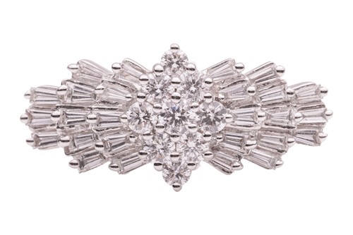 Lot 180 - A diamond-set dress ring, the central cluster...