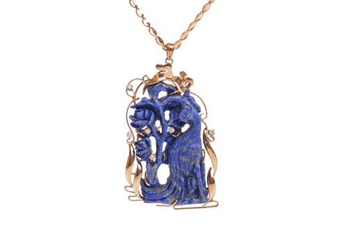 Lot 116 - A carved lapis lazuli pendant on chain, set...