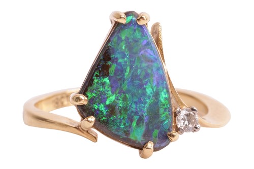 Lot 21 - A boulder opal dress ring, claw-set with a...