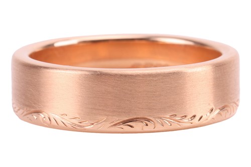 Lot 40 - A brush-finished ring band in 18ct gold, with...