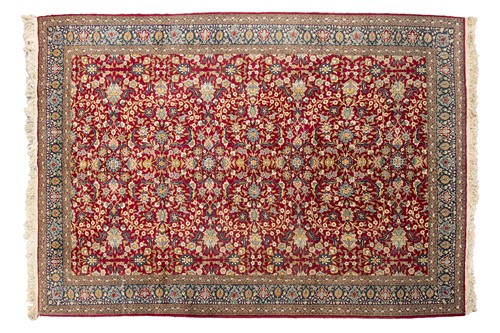 Lot 116 - An Indian handknotted rimson ground carpet,...