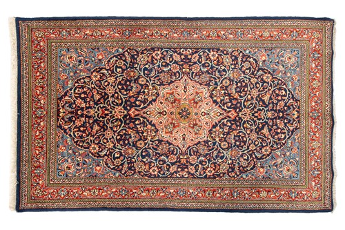 Lot 105 - A North West Persian Sarouk rug of bookcover...
