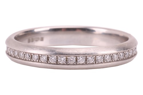 Lot 130 - A diamond eternity ring in platinum,...