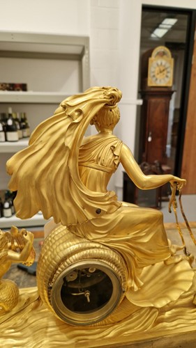 Lot 124 - A French Empire gilt bronze clock, depicting...