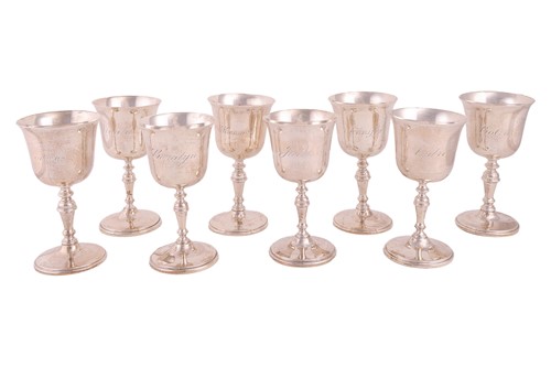 Lot 325 - A set of eight silver goblets, each with a...