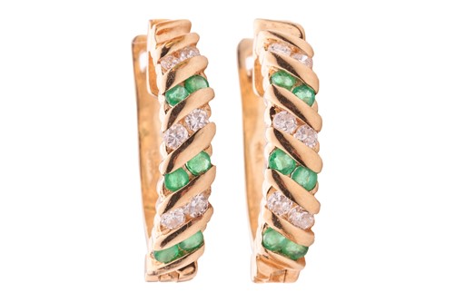Lot 153 - A pair of emerald and diamond-set hoop...