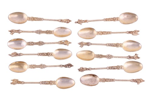 Lot 319 - A set of twelve cast white metal apostle...