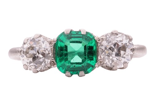 Lot 172 - An emerald and diamond three-stone ring, the...