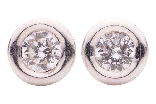Lot 131 - A pair of diamond earstuds, with an estimated...